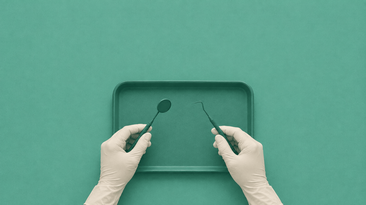 Top-down view of gloved hands holding a dental mirror and probe over a teal instrument tray.