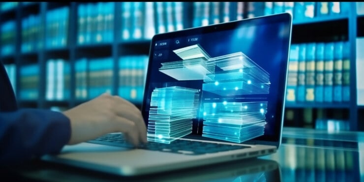 Hands and laptop with 3D documents